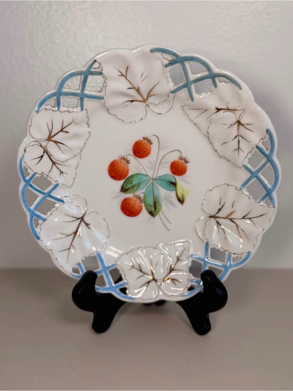 Decorative White Porcelain Plate with Blue Lattice and Strawberry Motif